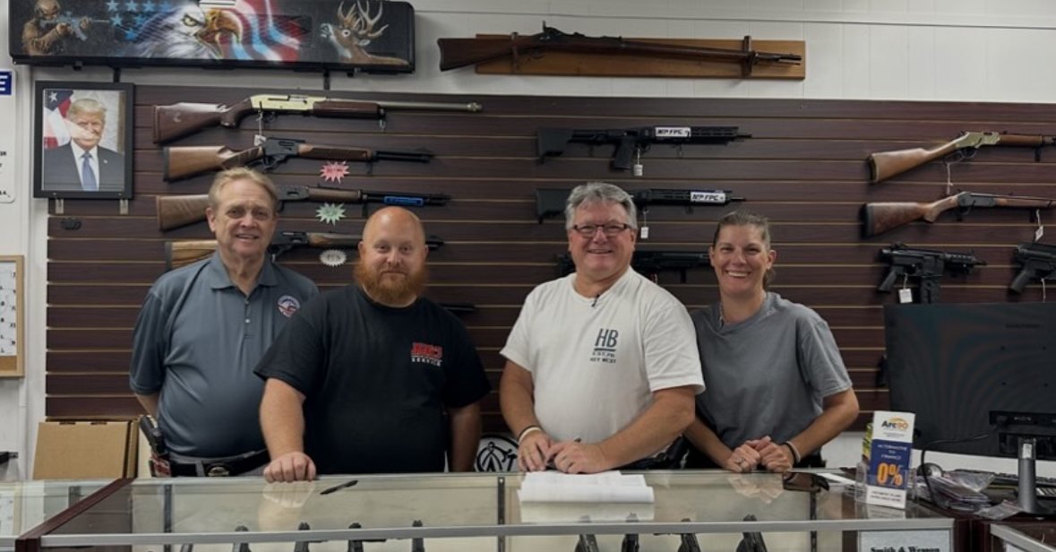 The Freedom Services & Training team behind the shop counter